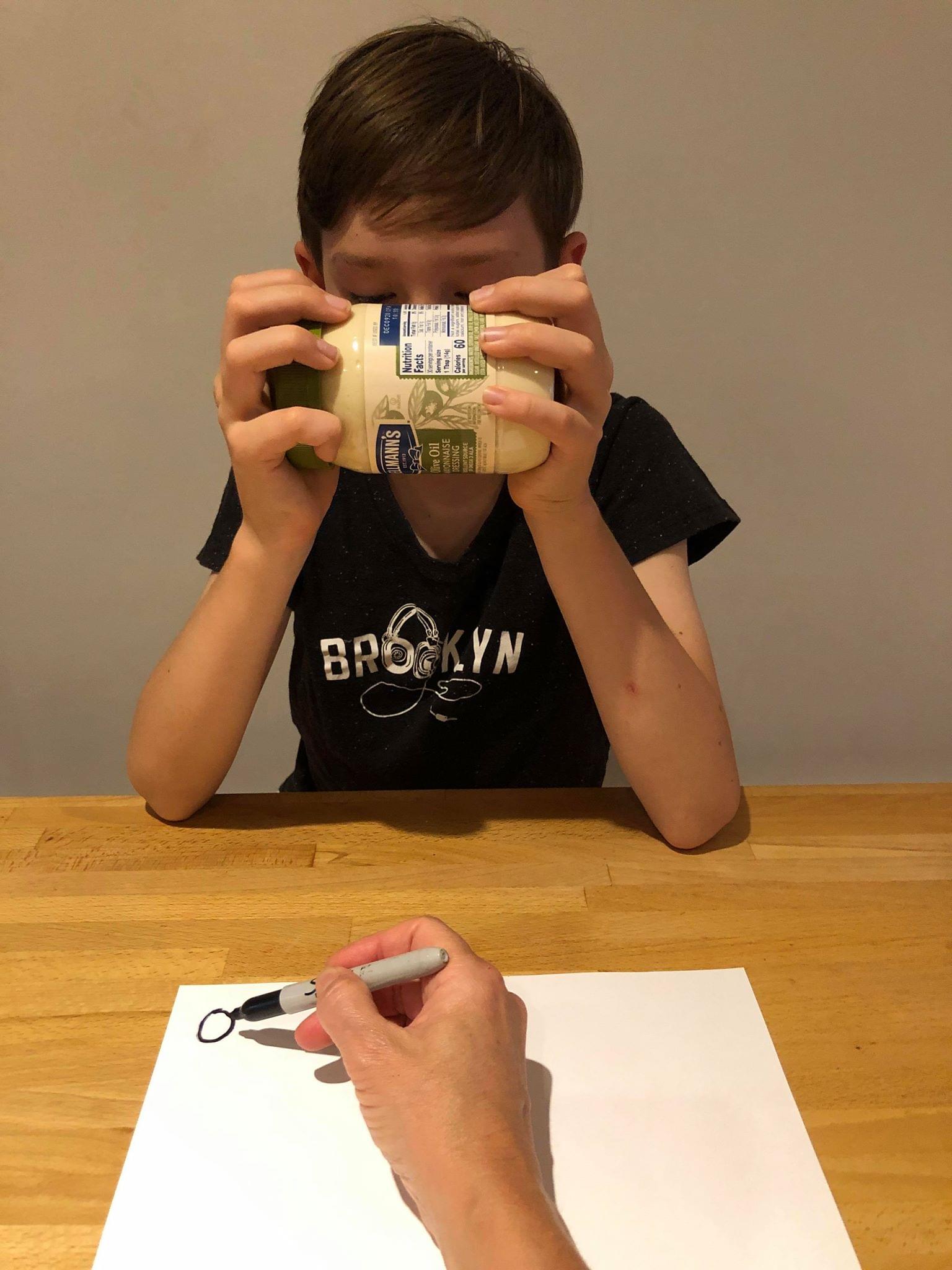 Child reading out each digit of the product code except the last digit.